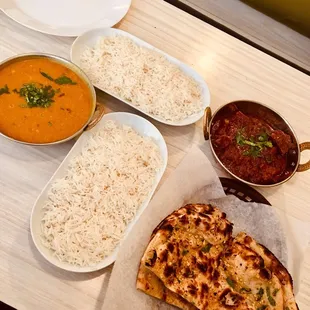 Tarka daal (left) &amp; goat curry (right) with garlic naan &amp; rice