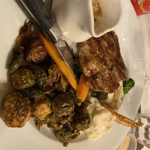 Grilled Pork Tenderloin Chop with Dijon Gravy, and side of crispy Brussels sprouts