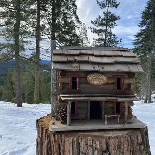 a log cabin in the snow