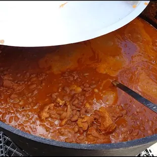 Next to the grill, Chef Bobby had a gigantic pot of barbecue beans, slowly simmering.