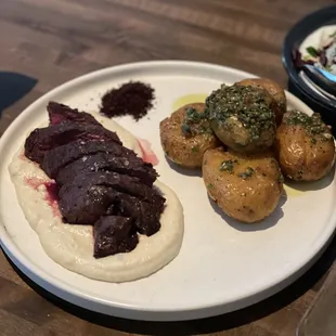 Hangar Steal - za&apos;atar butter, skordalia, chimichurri &amp; tumeric potatoes