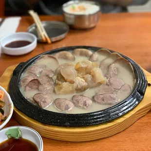 a hot pot with meat and vegetables