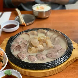 a hot pot with meat and vegetables