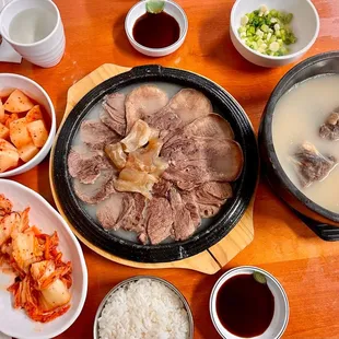 various dishes of food on a wooden table