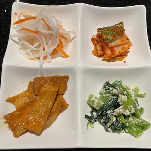 Side dishes -- Pickled Radish, Kimchi, Fish Cake, and Seasoned Spinach