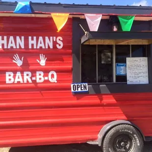 a man standing in front of a food truck