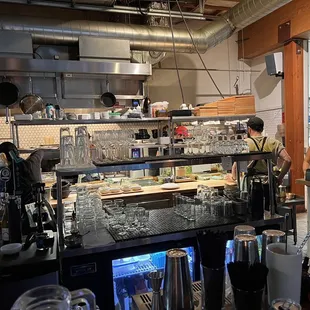 View of the kitchen from the bar. The staff are so friendly and fun with each other :)