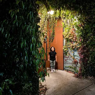 a woman standing in front of a door
