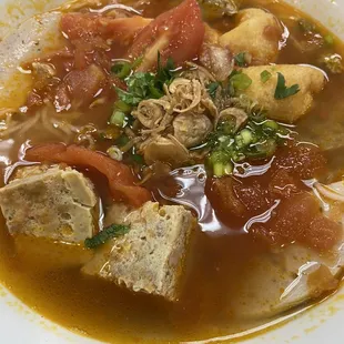 $13 bun rieu dong cua.  Top pieces cubes at 12 o&apos;clock are the crab, around the 6 o&apos;clock is the meat pieces. Really outstanding!