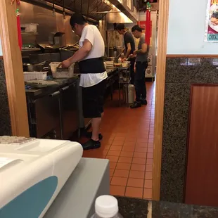 a man preparing food in a restaurant kitchen