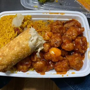 Orange chicken combo with undercooked raw dough spring roll