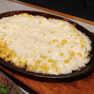 ows a dish of corn and beef