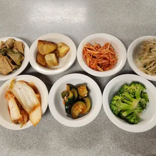 Stir-Fried Fish Cakes, Roasted Potatoes, Seasoned Radish, Soybean Sprouts Namul, Kimchi, Cucumber Kimchi, Broccoli Namul