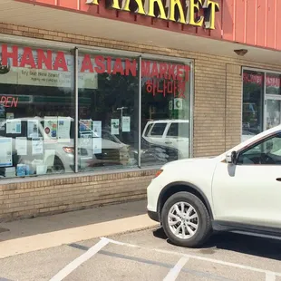 a car parked in front of the store