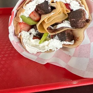 a plate of food on a red tray