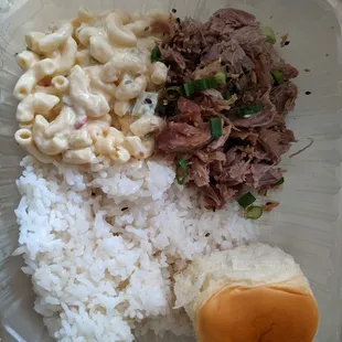 Kalua pork plate. Slow cooked pork (a balance of sweet and salty), macaroni salad, rice, and a sweet hawaiian roll