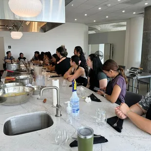 Gathered in anticipation to learn to make pasta....