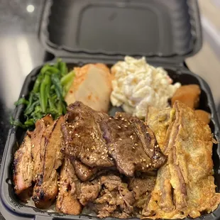 Kalbi, meatjun, grilled chicken with Mac salad, kimchi, and shoyu potatoes