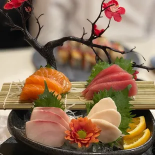 My special birthday plate full of the sashimi, roll, and hand roll I ordered.