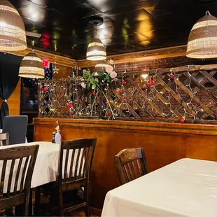 a dining area with tables and chairs