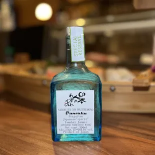 a bottle of gin on a counter