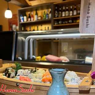 a blue vase with sushi on it