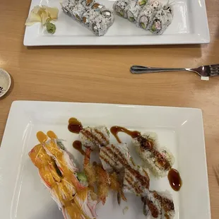 Top plate: R8. Philadelphia Roll and C3. California Roll Bottom plate: spicy cowgirl roll and S13. Captain Crunch Roll