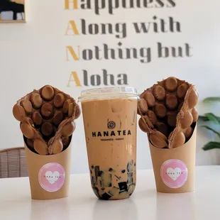 two cups of iced coffee with chocolate chips in them