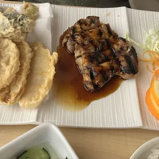 Chicken teriyaki and vegetable tempura combination plate.