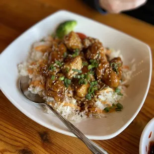 a bowl of rice and a bowl of broccoli