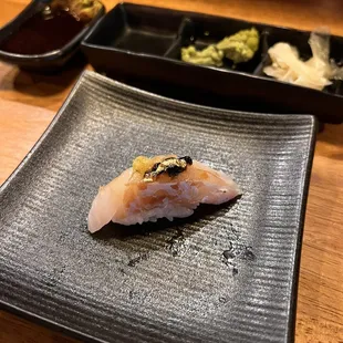 a sushi on a plate