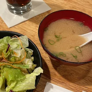 a bowl of soup and a bowl of salad