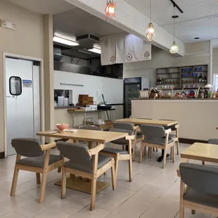 Dining room; door to kitchen; front counter. 3 two-tops &amp; 6 four tops. Three seat couch plus standing room make up the &apos;waiting area&apos;.