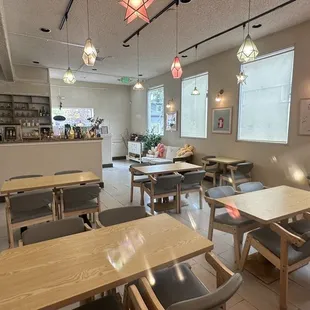 an empty restaurant with tables and chairs