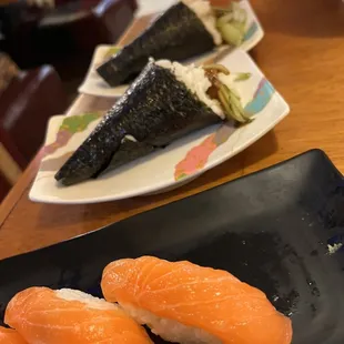 three pieces of sushi on a plate