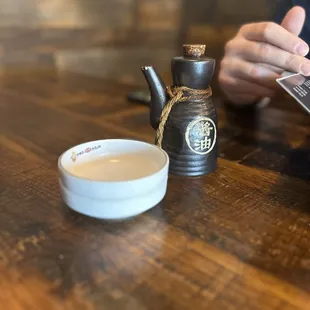 a person holding a cup of tea