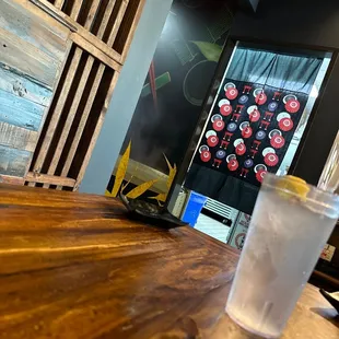 a glass of water on a wooden table