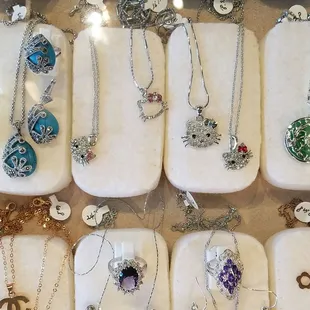 a display of necklaces and pendants