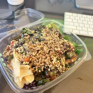 a salad in a plastic container