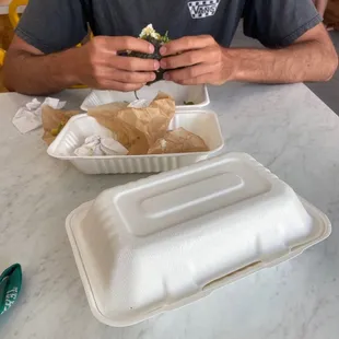 a man eating a sandwich