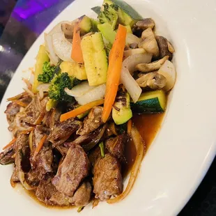 beef and vegetables on a plate
