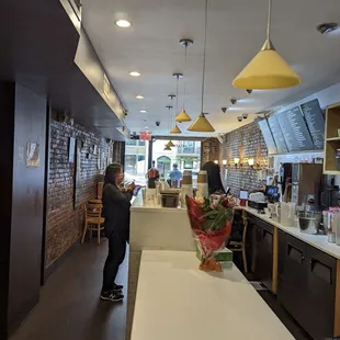 a man standing in a coffee shop