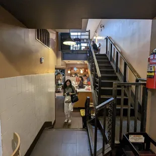 a woman walking down the stairs