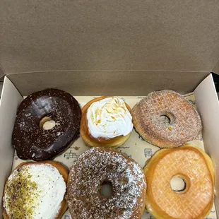 chocolate ganache, blood orange cream with merengue, earl grey, rose water pistachio, cinnamon streusel buttermilk glazed.