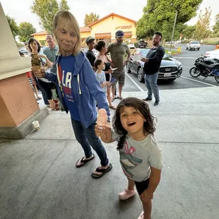 Enjoying some ice cream on a hot day.