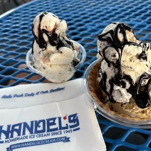 Small bowl of Chocolate Chip Cookie Dough w/ hot fudge; small waffle bowl of S'more's and Cheesecake w/ Oreo pieces and hot fudge.