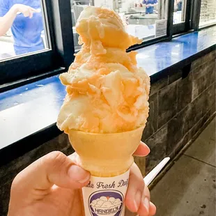 ORANGE DREAM CREAM - orange sherbet and vanilla ice cream mixed together. This is a *small* in a cake cone