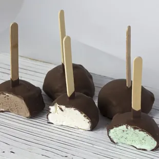 A scoop of our delicious homemade ice cream, dipped in decadent chocolate.