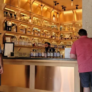 two men standing at the bar