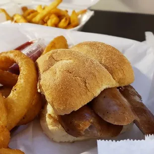 Double Johnsonville Brat with onion rings and fries